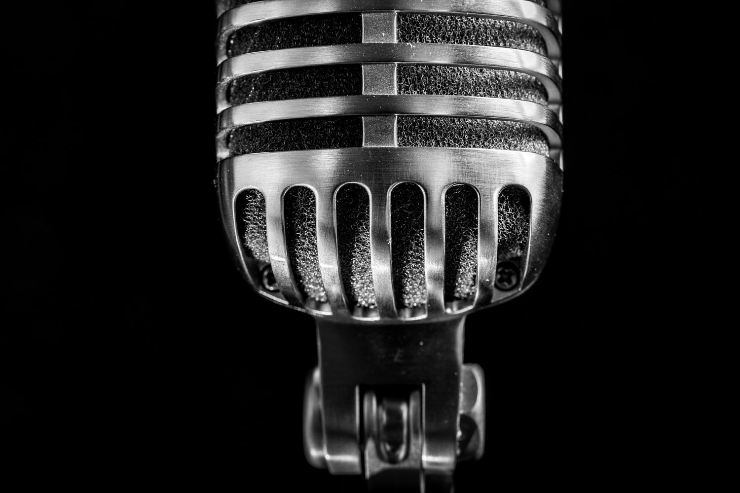 Vintage microphone on black background